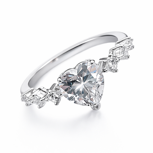 Silver ring with a heart-shaped diamond on a white background