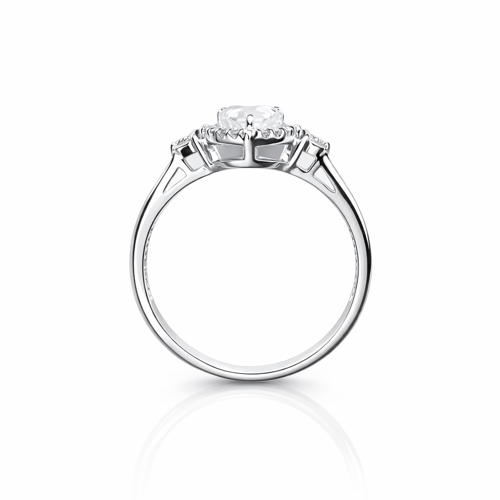 Diamond ring with three clear gemstones on a white background