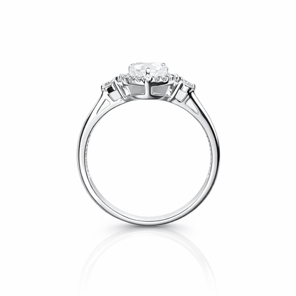 Cubic zirconia ring with three clear gemstones on a white background