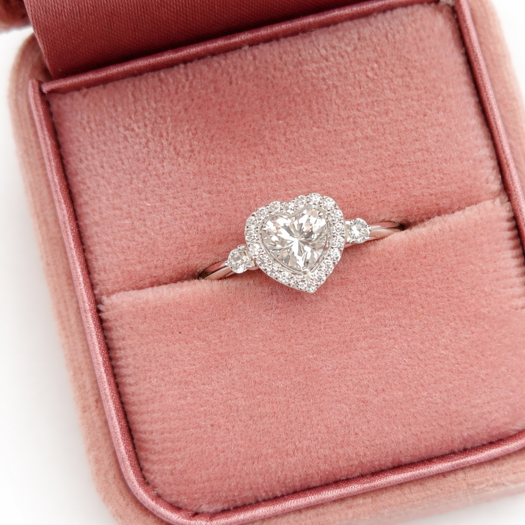 Heart-shaped diamond ring in a pink jewelry box