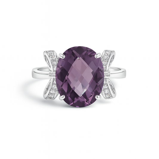 Ring with a large amethyst and zirconia-studded bow